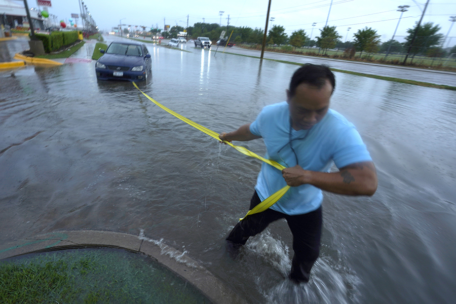 Photo of a man in flood waters