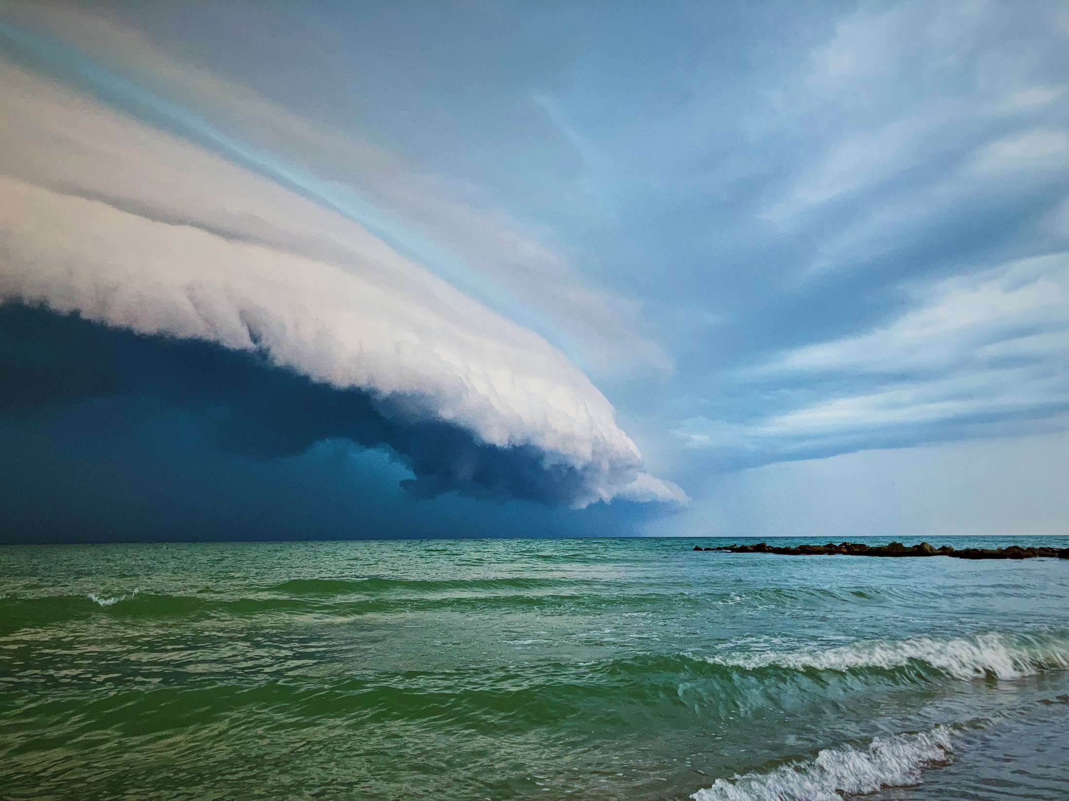Photo of storm cloud over ocean