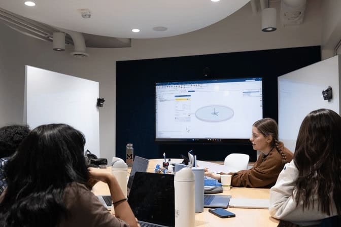 Photo of student teams working together in the Leinweber Innovation Laboratory